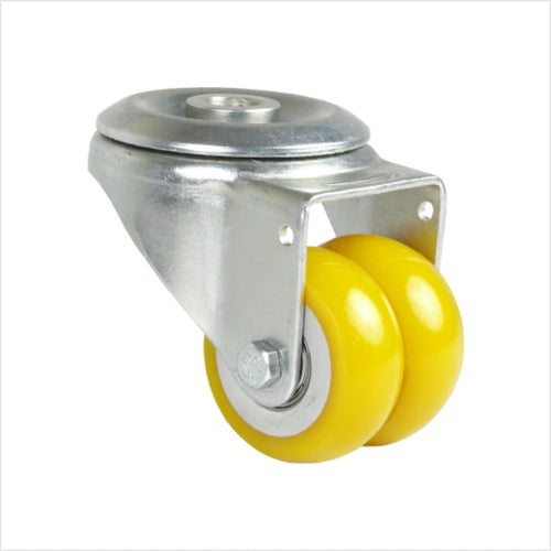 Mini rueda giratoria de alta resistencia con orificio de montaje para un solo tornillo. Cuenta con dos ruedas que forman una rueda doble con banda de rodadura convexa de poliuretano en color amarillo.
